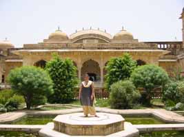 Monkey takes pig for a ride